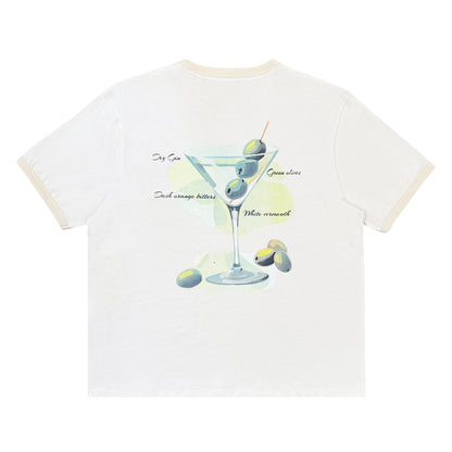 White t-shirt with a cocktail graphic and text on a white background